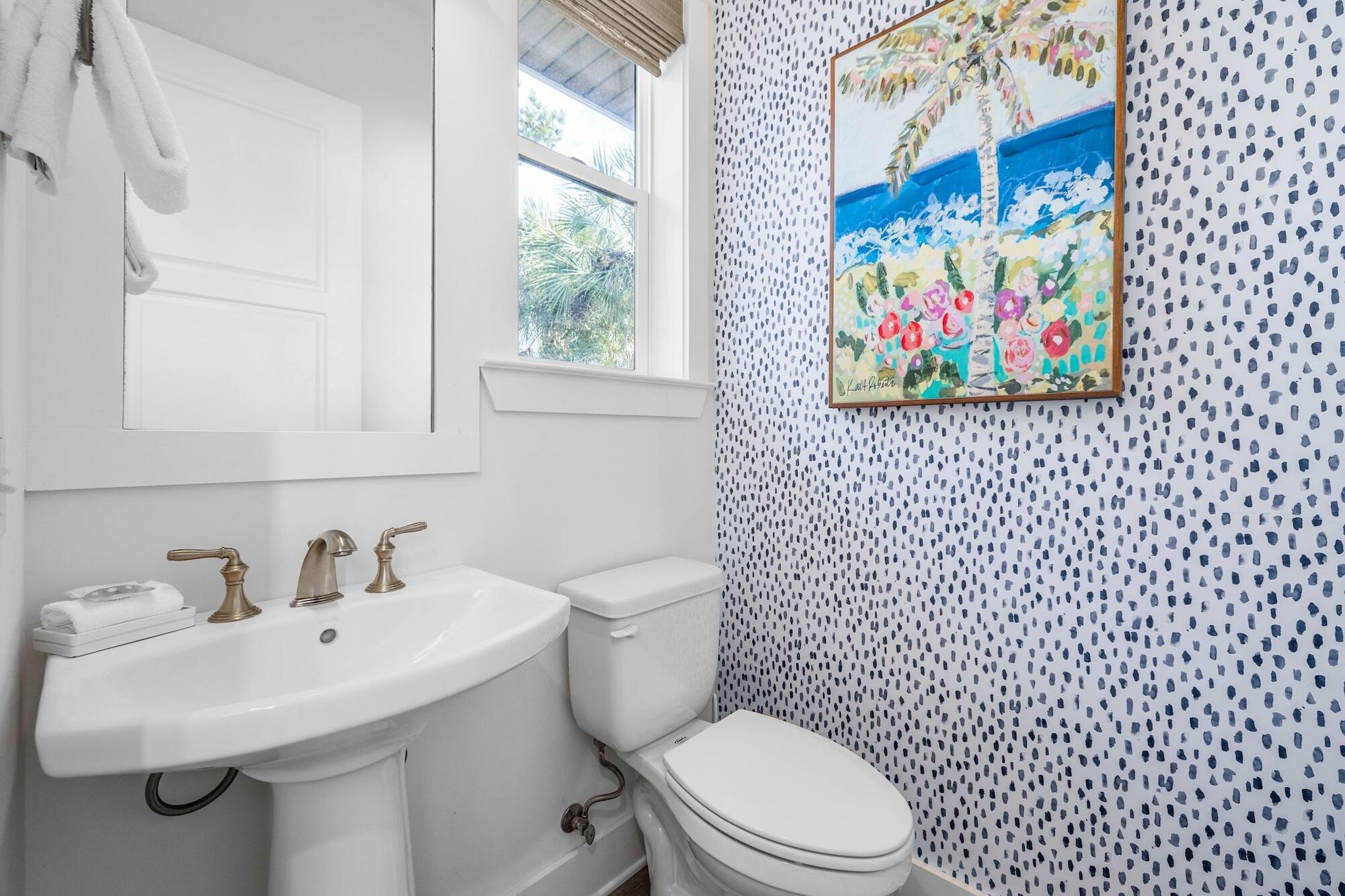 170 Seacrest Beach Boulevard East Inlet Beach, FL 32461 - Photo 4 of 38 a bathroom with a toilet a sink and a window
