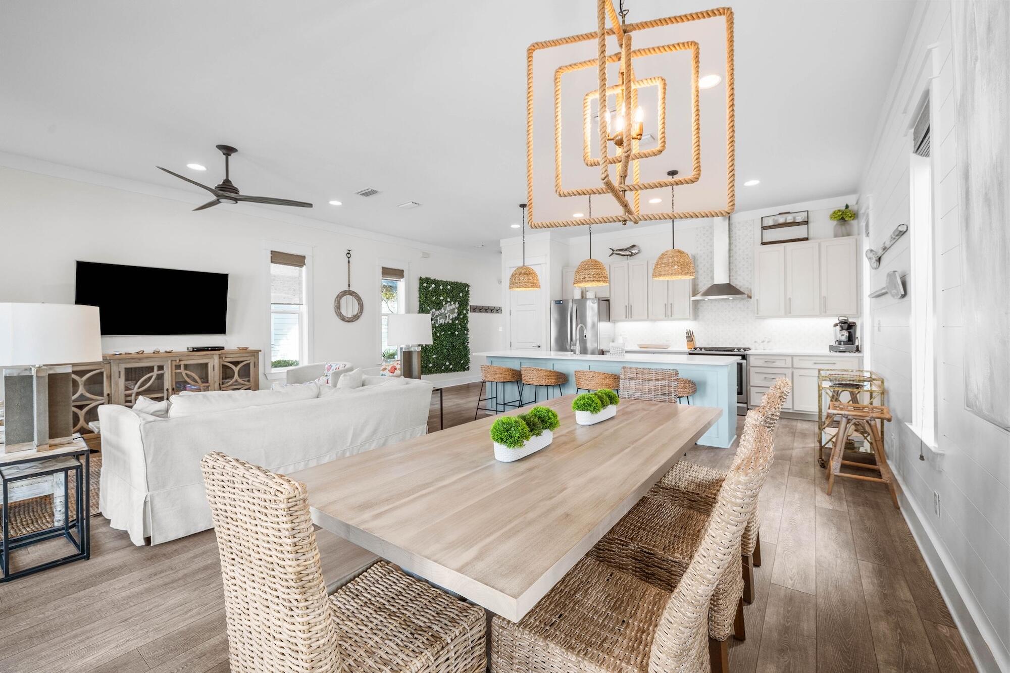 170 Seacrest Beach Boulevard East Inlet Beach, FL 32461 - Photo 7 of 38 a living room with furniture a flat screen tv and kitchen view