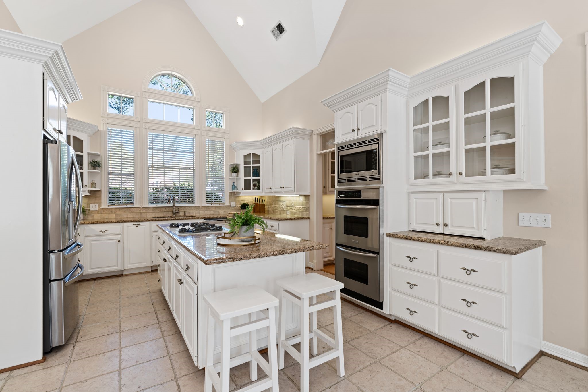 2 Bridgeberry Court Spring, TX 77381 - Photo 13 of 50 a kitchen with a stove oven and cabinets
