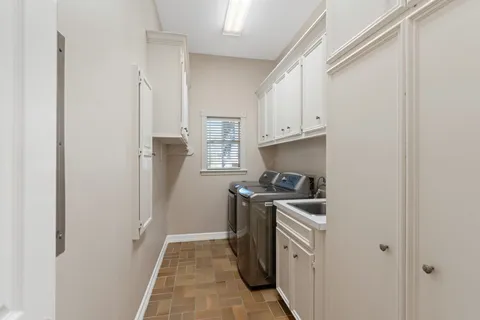 a kitchen with a stove top oven a sink and dishwasher