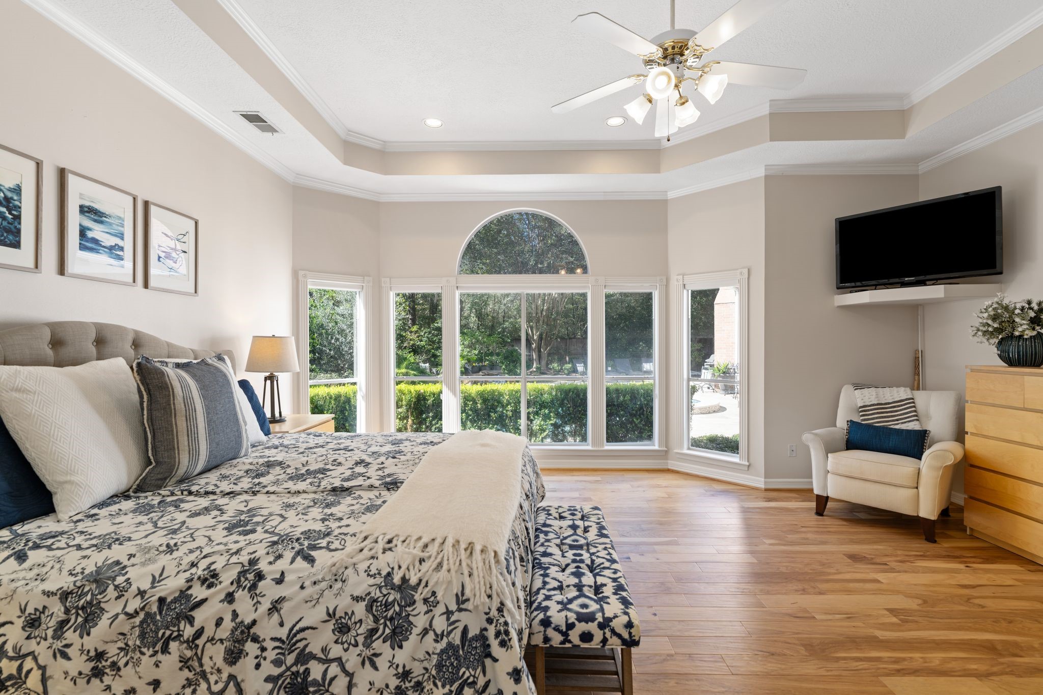 2 Bridgeberry Court Spring, TX 77381 - Photo 21 of 50 a large bedroom with a bed and a large window with wooden floor