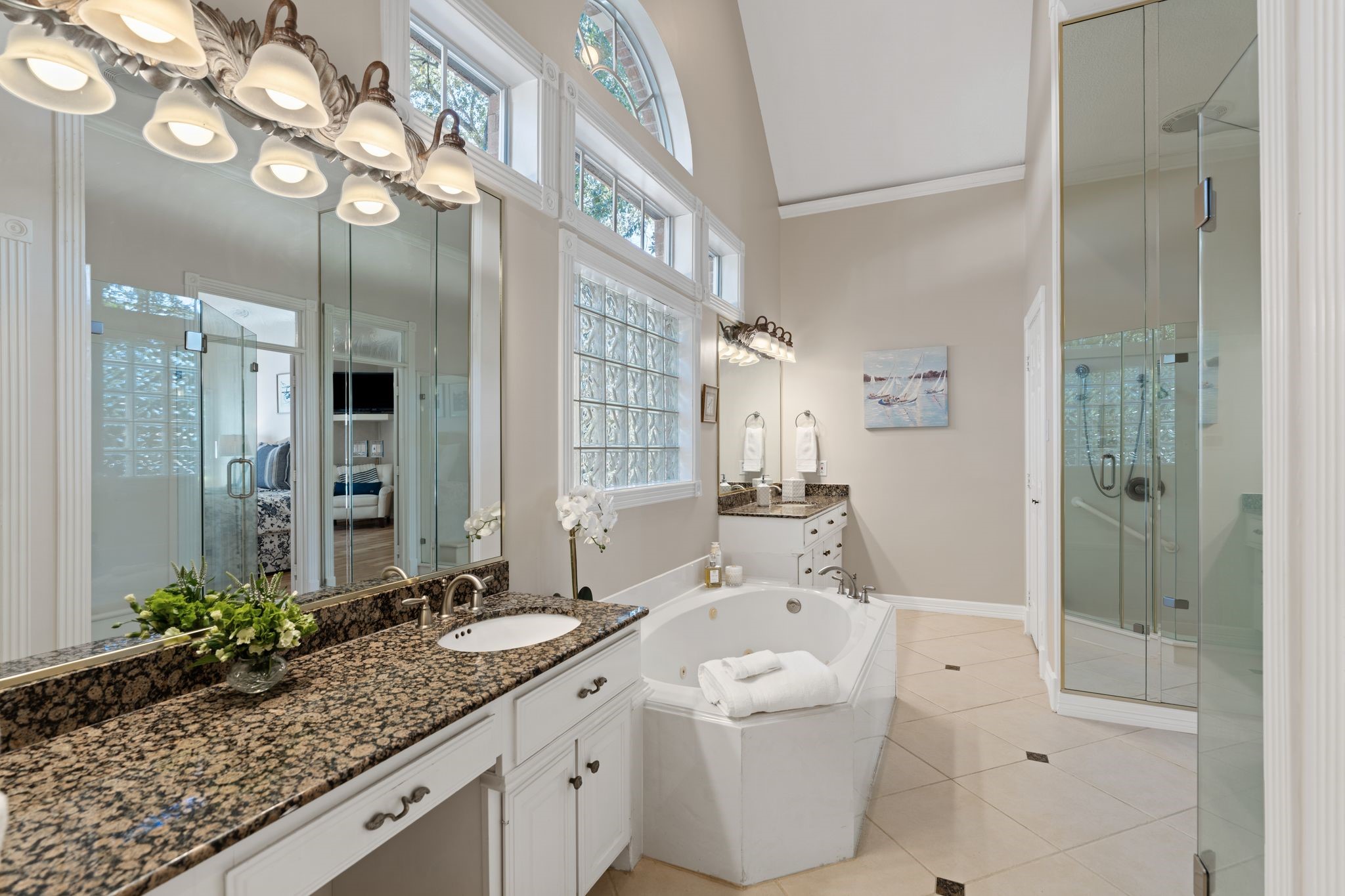 2 Bridgeberry Court Spring, TX 77381 - Photo 24 of 50 a spacious bathroom with a granite countertop sink mirror and shower