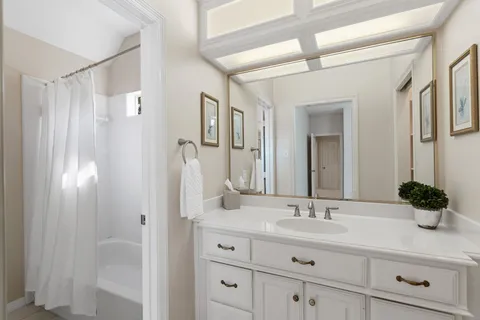 a bathroom with a double vanity sink mirror and double