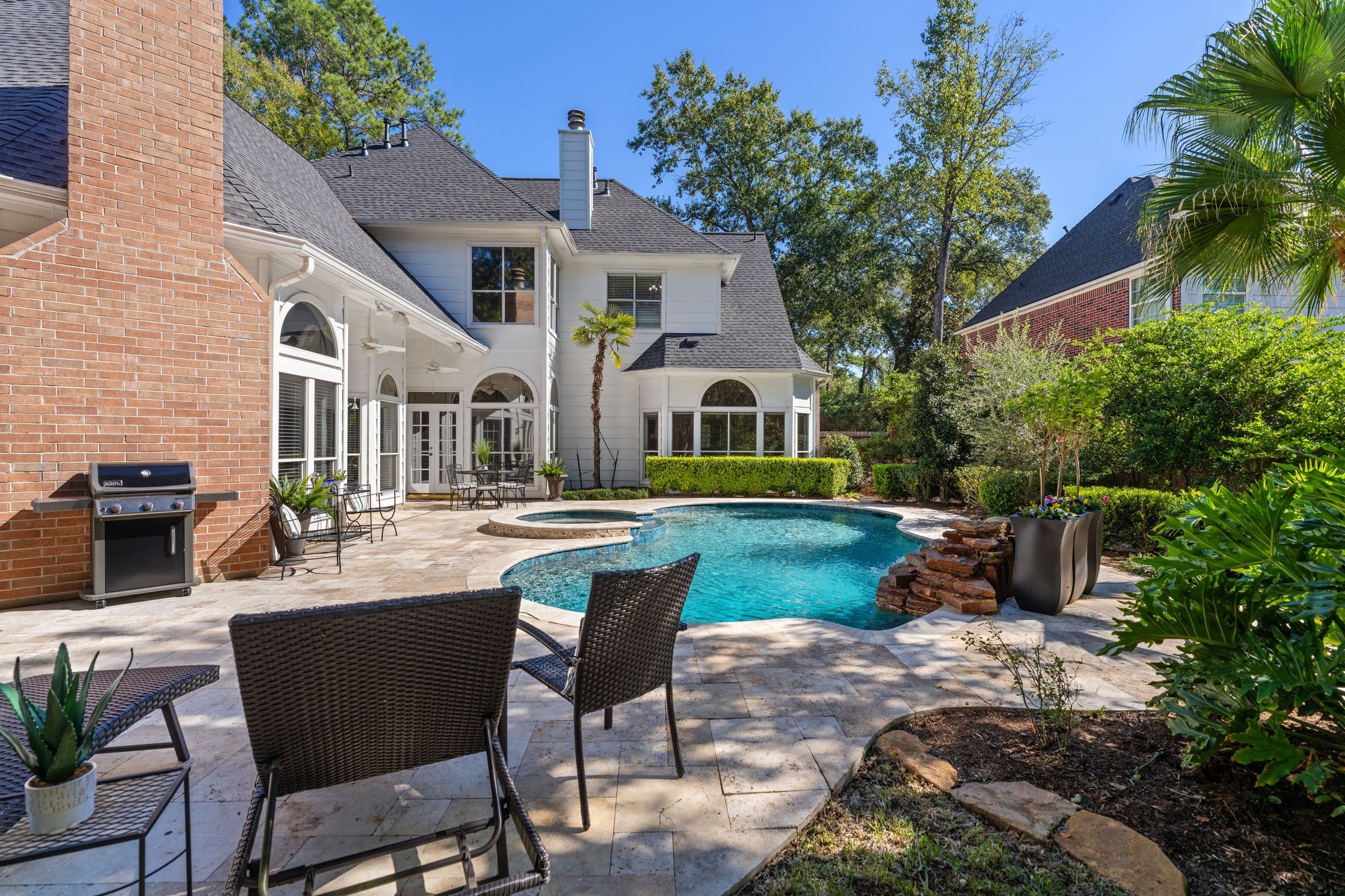 2 Bridgeberry Court Spring, TX 77381 - Photo 38 of 50 a view of a house with backyard sitting area and garden
