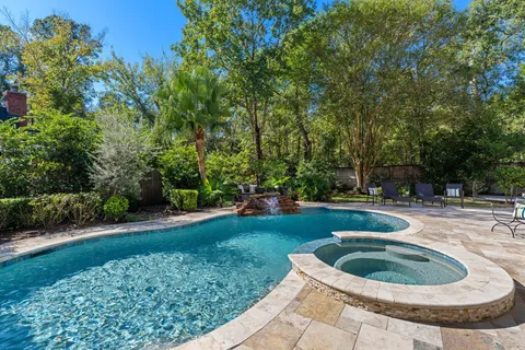 a patio with water table and chairs