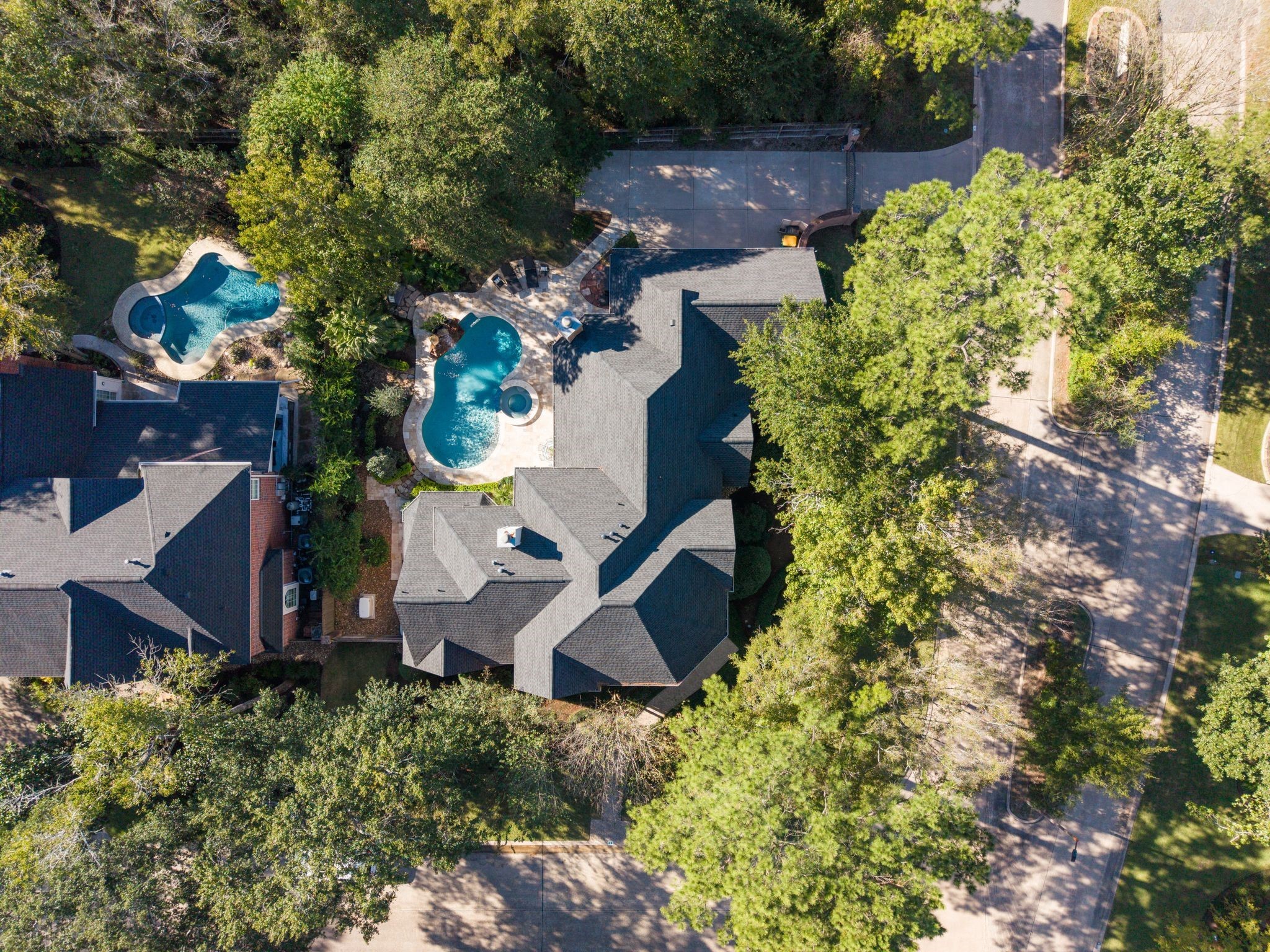 2 Bridgeberry Court Spring, TX 77381 - Photo 46 of 50 an aerial view of a house with a yard and outdoor seating