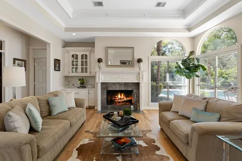 a living room with furniture and a fireplace