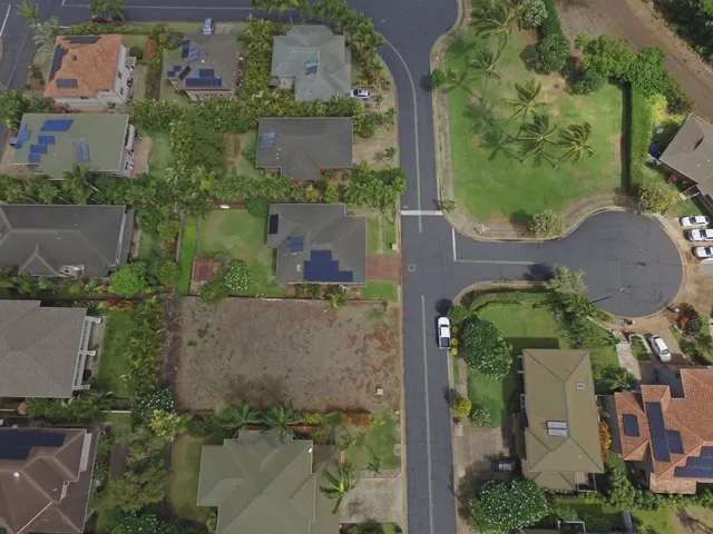 an aerial view of houses with outdoor space