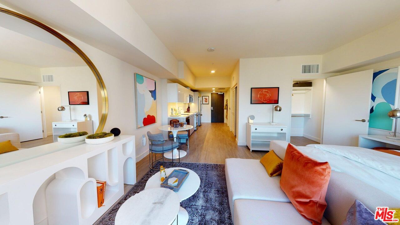 2801 Sunset Place, Unit 2213 Los Angeles, CA 90005 - Photo 2 of 7 a living room filled with furniture and a flat screen tv