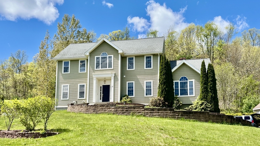 7 Deer Run Charlton, MA 01507 - Photo 1 of 42 front view of a house with a yard