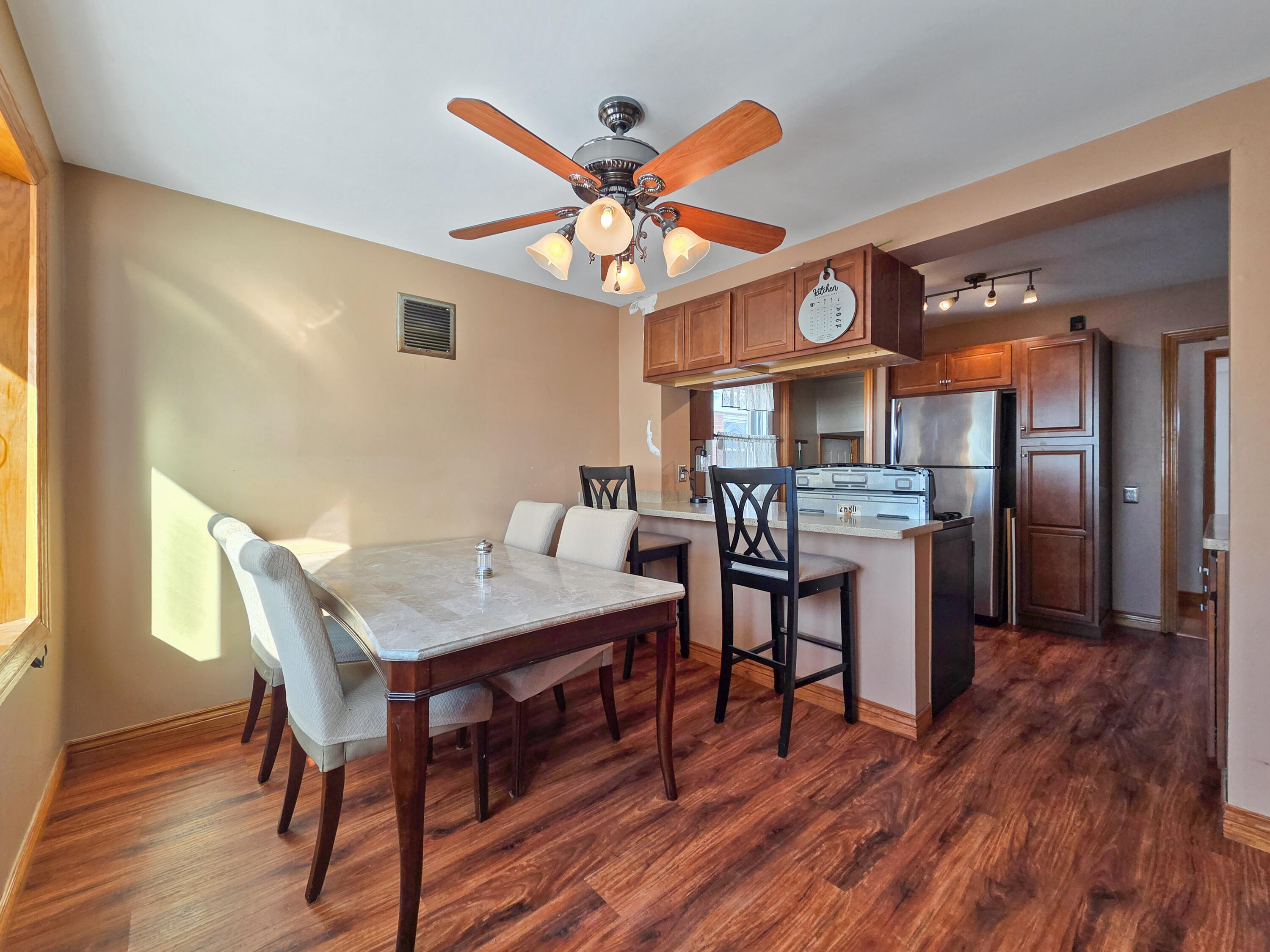 1472 Atlas Street Hammond, IN 46320 - Photo 11 of 27 a view of a dining room with furniture and wooden floor
