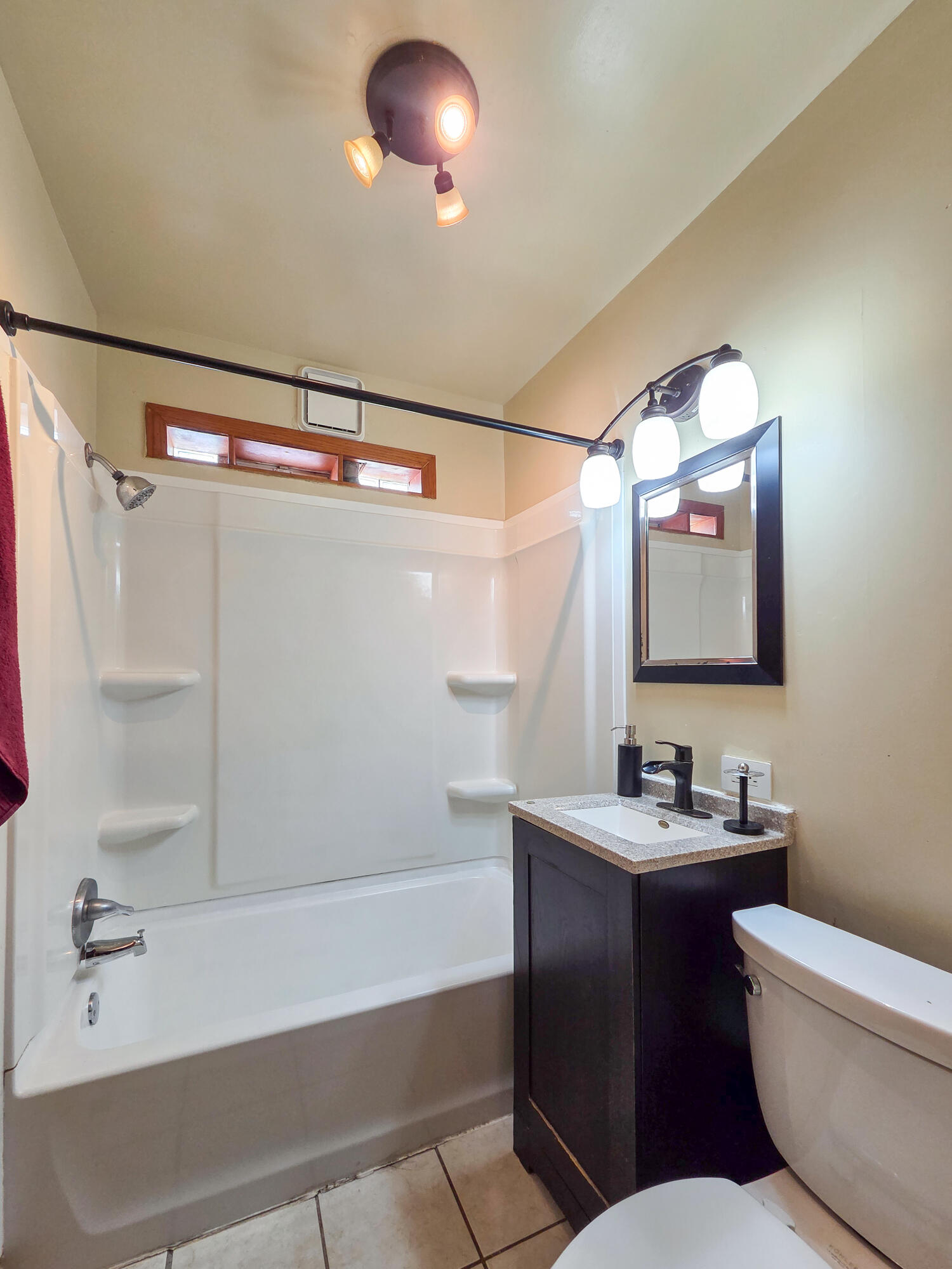 1472 Atlas Street Hammond, IN 46320 - Photo 14 of 27 a bathroom with a bathtub sink vanity mirror and toilet