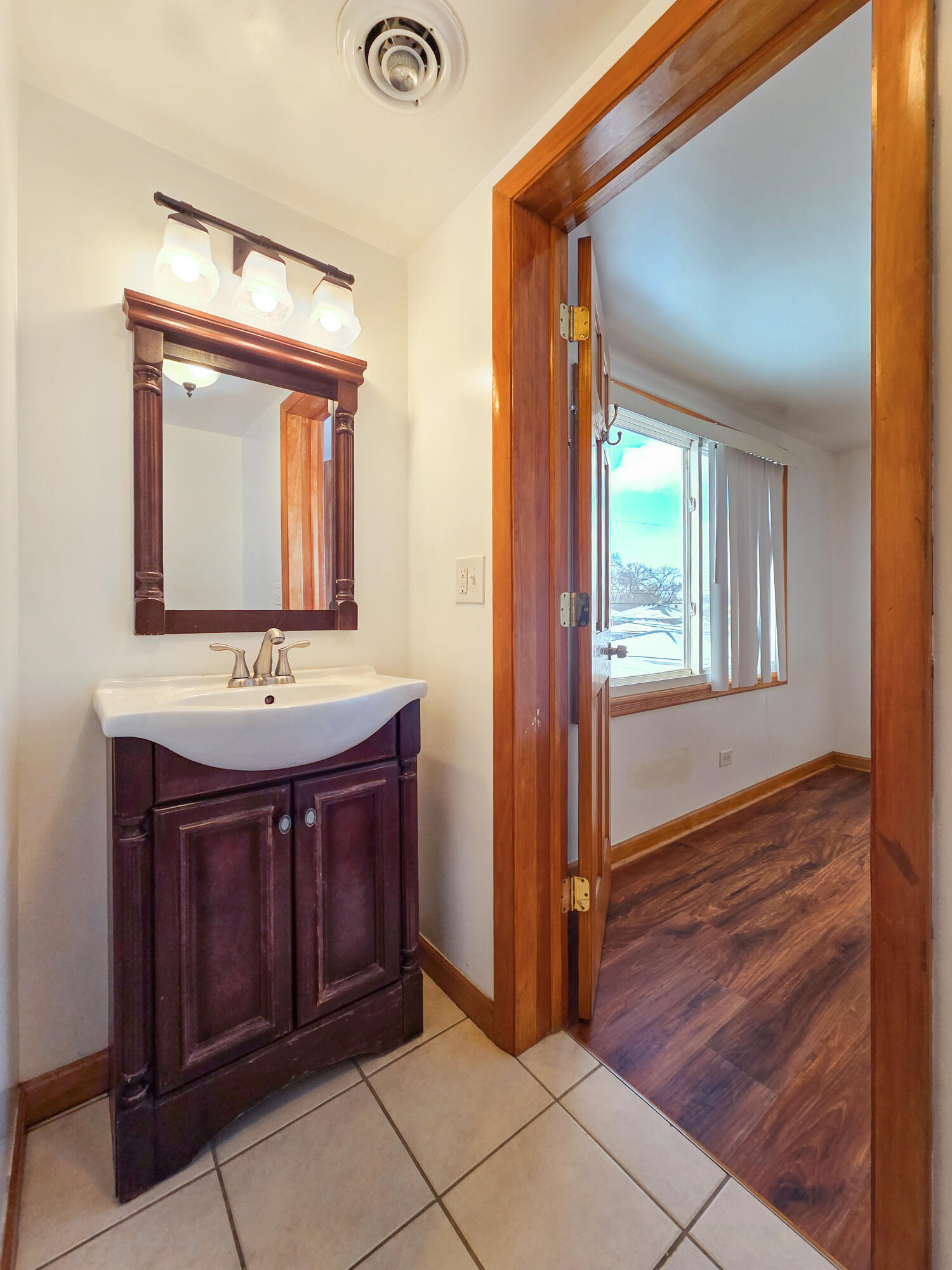1472 Atlas Street Hammond, IN 46320 - Photo 22 of 27 a bathroom with a sink and a mirror