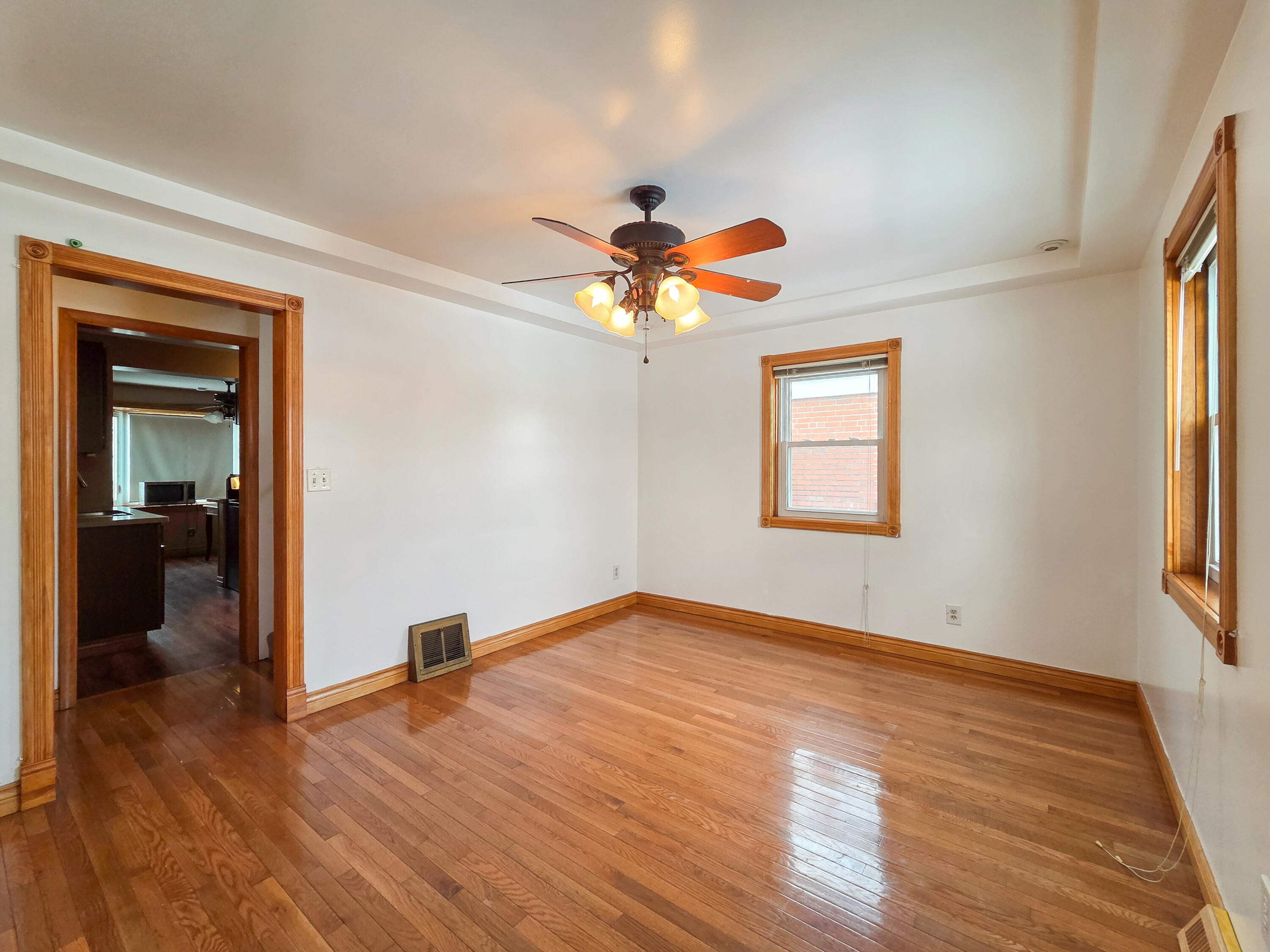 1472 Atlas Street Hammond, IN 46320 - Photo 3 of 27 wooden floor in an empty room with a window