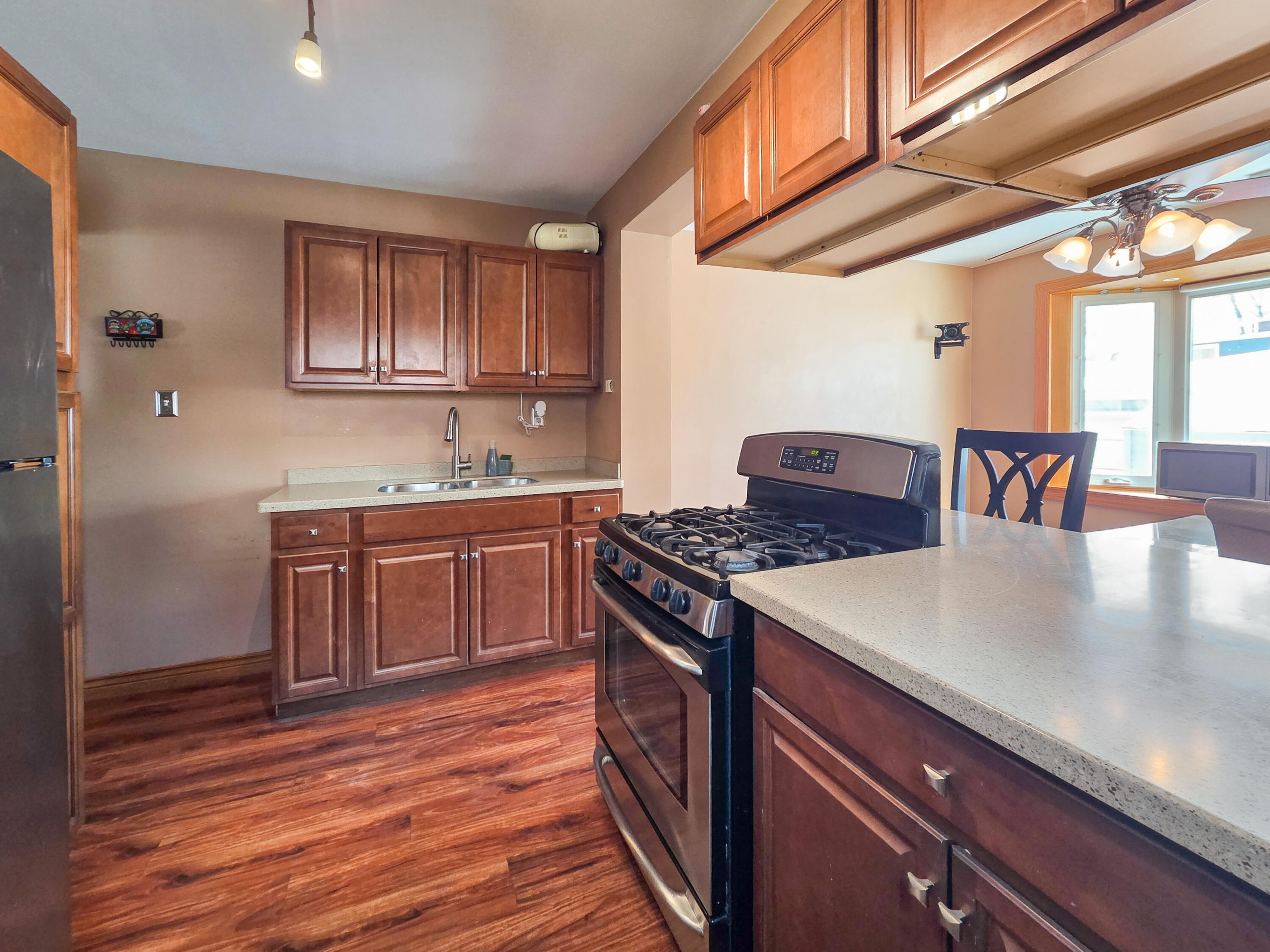 1472 Atlas Street Hammond, IN 46320 - Photo 6 of 27 a kitchen with a stove and a refrigerator