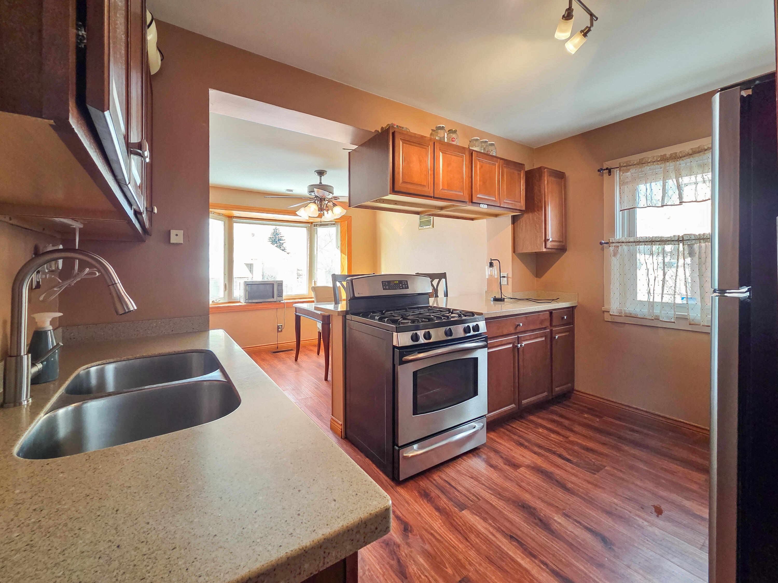 1472 Atlas Street Hammond, IN 46320 - Photo 8 of 27 a kitchen with stainless steel appliances granite countertop a sink stove and refrigerator