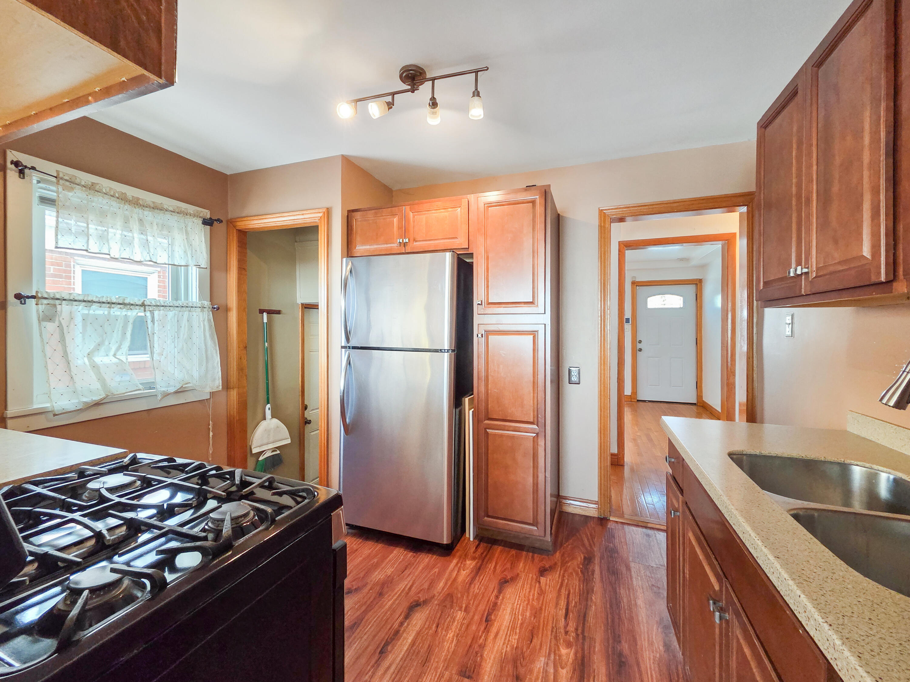 1472 Atlas Street Hammond, IN 46320 - Photo 9 of 27 a kitchen with stainless steel appliances granite countertop a refrigerator and a sink