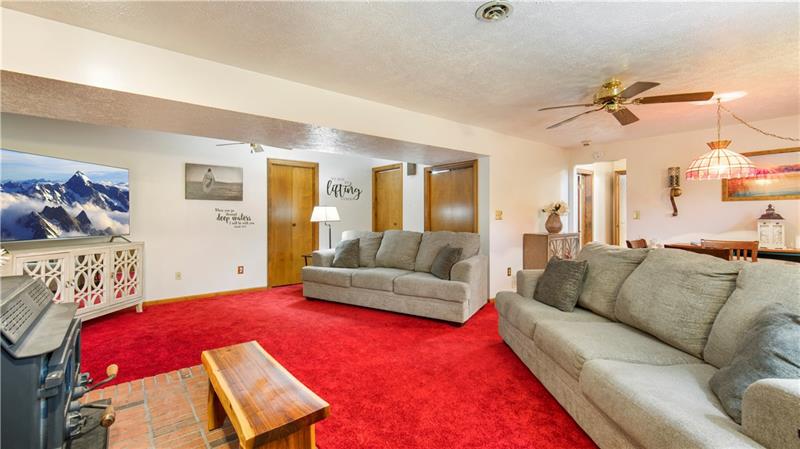762 Central School Road Perryopolis, PA 15473 - Photo 14 of 25 How big is this room that two full size couches fit so easily !!