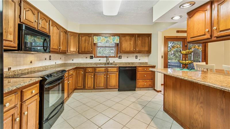 762 Central School Road Perryopolis, PA 15473 - Photo 7 of 25 Granite countertops and solid wood cabinetry.