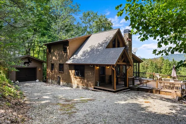 front view of a house with a tree