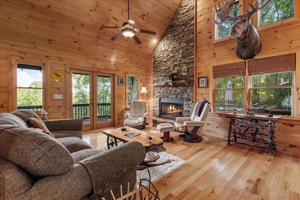 244 Indian Ridge Road Epworth, GA 30541 - Photo 18 of 47 a living room with furniture fireplace and large windows