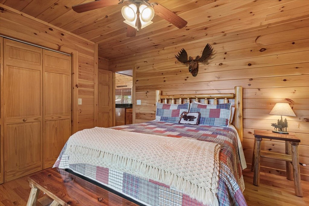 244 Indian Ridge Road Epworth, GA 30541 - Photo 29 of 47 a bedroom with a bed and wooden floor