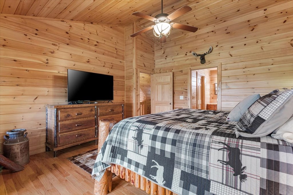 244 Indian Ridge Road Epworth, GA 30541 - Photo 34 of 47 a bedroom with a bed and a flat screen tv