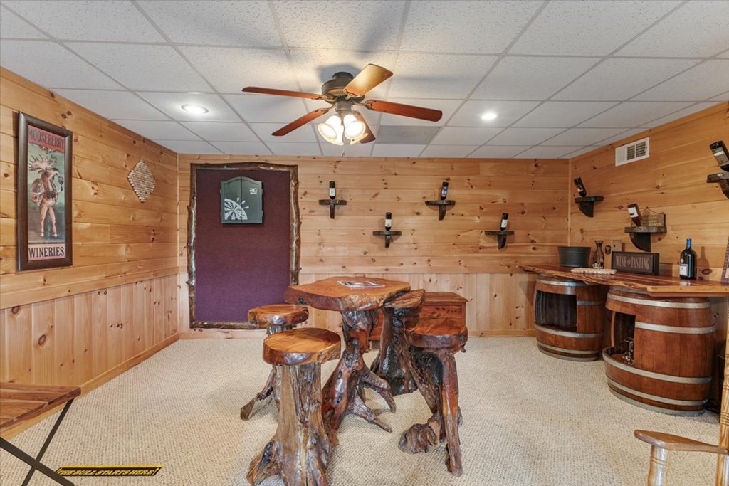 244 Indian Ridge Road Epworth, GA 30541 - Photo 42 of 47 a kitchen with stainless steel appliances kitchen island granite countertop a table chairs in it and wooden floors
