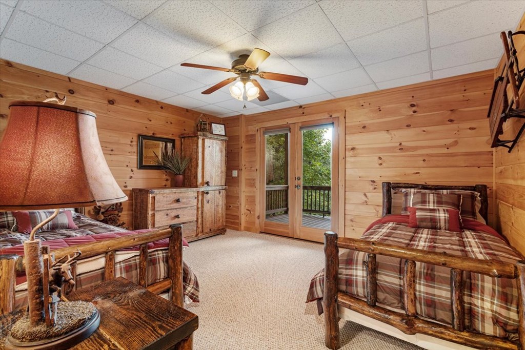 244 Indian Ridge Road Epworth, GA 30541 - Photo 44 of 47 a bedroom with furniture and a flat screen tv