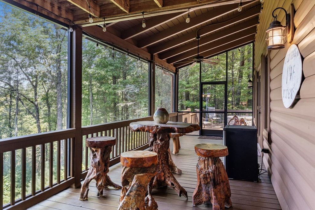 244 Indian Ridge Road Epworth, GA 30541 - Photo 6 of 47 a view of a patio with wooden floor and outdoor seating