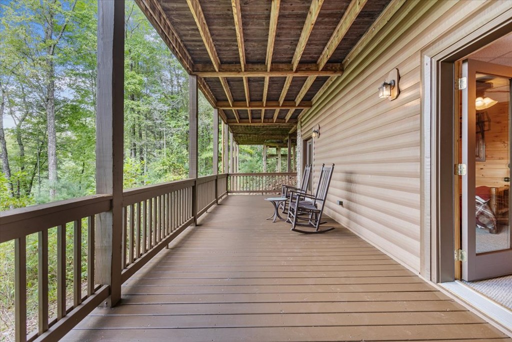 244 Indian Ridge Road Epworth, GA 30541 - Photo 7 of 47 a view of a two chairs in the balcony next to a yard