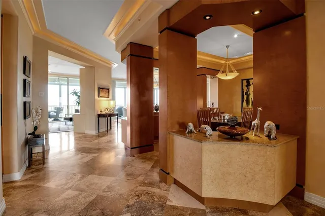 a living room with furniture a rug and a large mirror