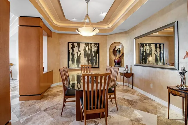 a living room with furniture flowerpot and a window