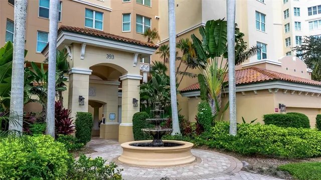 a living room with furniture and a painting on the wall