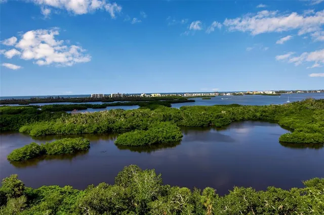 a bedroom with a bed and a table in it