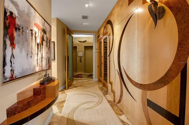 a view of a balcony with furniture and a floor to ceiling window