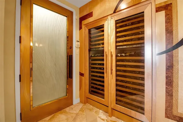 a kitchen with stainless steel appliances kitchen island granite countertop a sink and cabinets