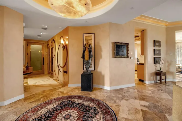 a kitchen with stainless steel appliances granite countertop a sink a stove and a refrigerator