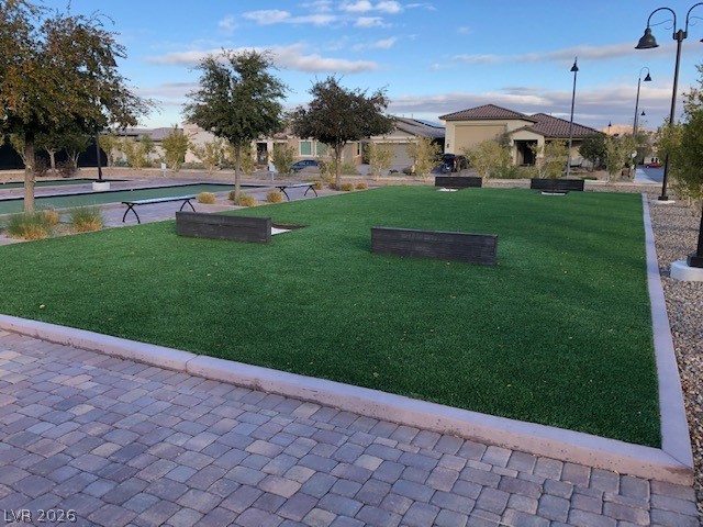 498 Pebble Run Avenue Henderson, NV 89011 - Photo 45 of 47 Enjoy outdoor games on this spacious, well-maintained community lawn.