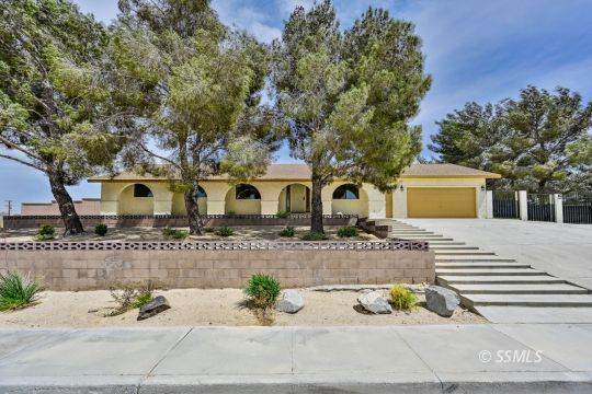 418 North Inyo Street Ridgecrest, CA 93555 - Photo 1 of 35 a front view of a house with a yard