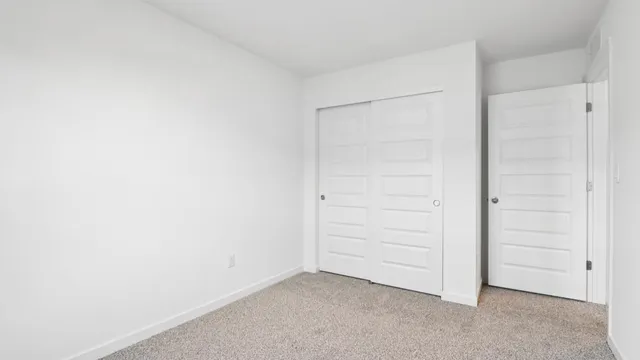 a view of a livingroom with furniture and a window