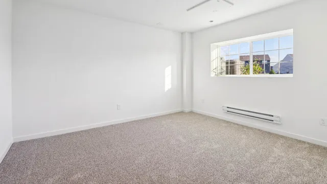 a kitchen with refrigerator a table and chairs