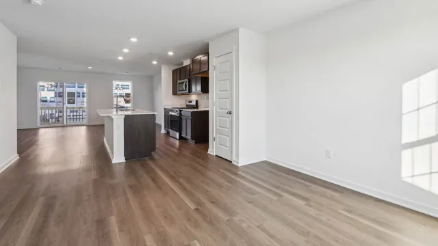 a view of kitchen with cabinets and wooden floor