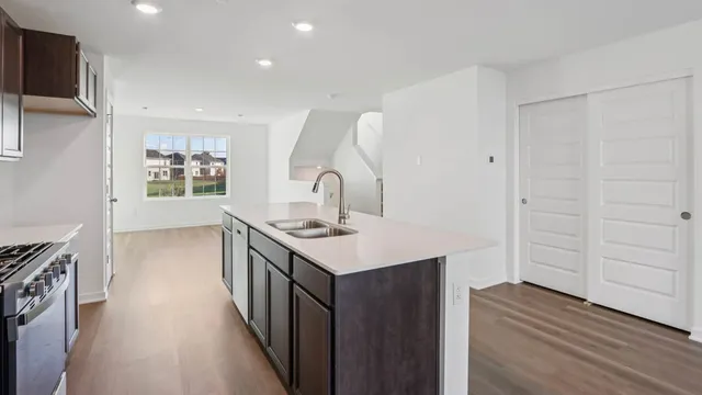 a view of kitchen with wooden floor and window