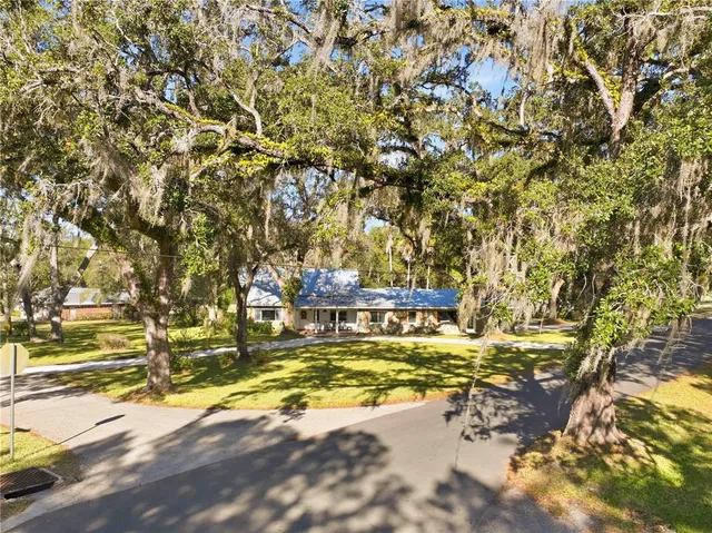 a view of a yard with swimming pool
