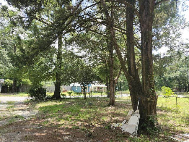 248 South Booker Street Crestview, FL 32536 - Photo 2 of 5 a view of outdoor space with trees