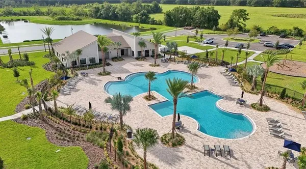 an aerial view of a swimming pool and outdoor space