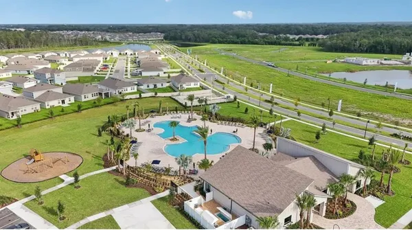 an aerial view of a house with a ocean view