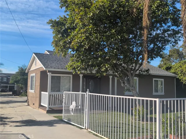 a view of a house with a small yard