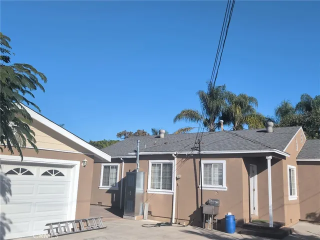 a view of a house with a street
